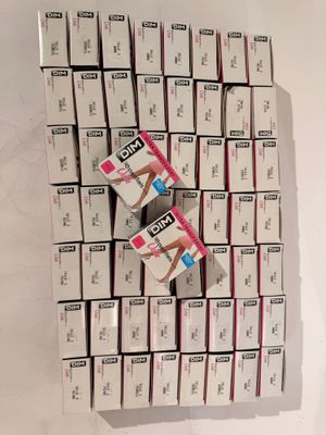 several boxes of cigarettes are stacked on top of each other on a white surface