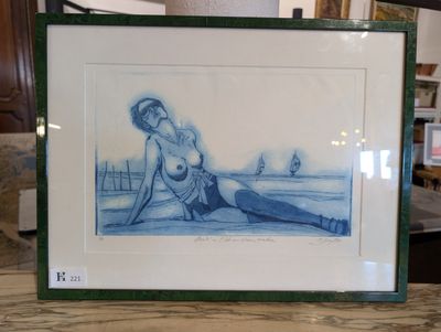 a picture of a picture of a woman sitting on the beach