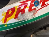 a close up of a sign on a motor scooter