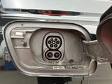 a close up of a car ' s fuel tank with an electrical outlet