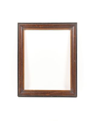 an empty wooden picture frame on a white wall