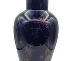 a blue vase with a cracky design on it
