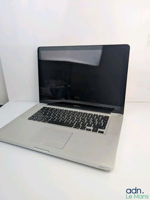 an apple macbook pro laptop computer sitting on top of a white table