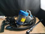 a vacuum that is sitting on top of a wooden table