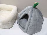 two dog beds that are sitting on a table