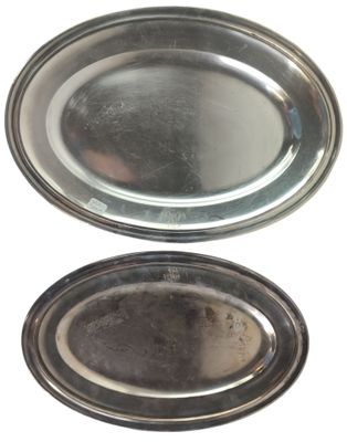 two silver plates with a silver rim and a silver plate with a silver rim