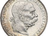 Gros plan sur une pièce de monnaie portant le visage d'un homme