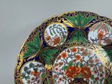 a plate with a floral design on it on a table