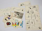 a lot of drawings and pictures of people on a table