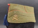 a close up of a military hat with a skull and crossbone on it