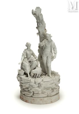 statue représentant un homme et une femme assis sur un rocher, accompagnés d'un chien