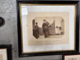 a framed picture of a man and a woman sitting on a bench