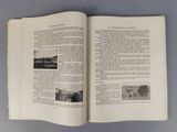 an open book with pictures on it on a table