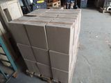 a large stack of boxes sitting on a pallet in a warehouse