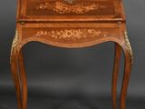 a small wooden table with a drawer on top of it