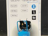 an image of a blue air compressor sitting on top of a cardboard box