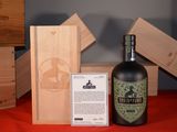 a bottle of wine sitting next to a wooden box