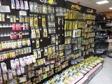 many different types of pens on display in a store