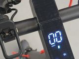 a clock on the handlebar of a bike