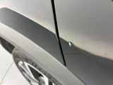a close up of a car ' s front bumper with a hole in it