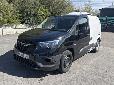 a black and white van parked in a parking lot
