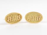 a pair of gold tone cufflinks with the word ' love ' engraved on them