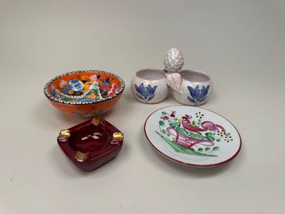 three small bowls and a small bowl on a white table
