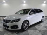 a picture of a white car parked in a garage