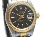 rolex watch with black dial and yellow gold bezel