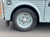 an image of an old blue truck parked in a parking lot