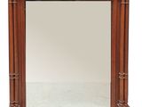 image d'un miroir avec un cadre en bois sur fond blanc