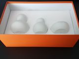 a box with three eggs in it on a table