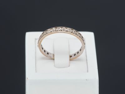 a close up of a ring in a white box on a black background