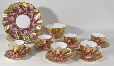 an image of a group of coffee cups and saucers on a table