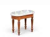 a small wooden stool with a blue and white pattern on it