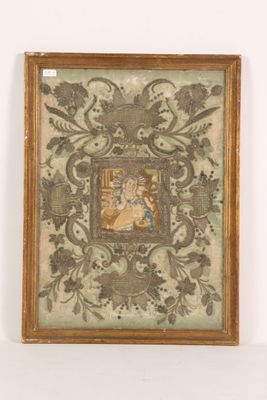 painting of a woman and a child in a frame on a wall