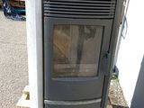 a stove that is sitting on a pallet outside