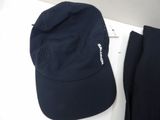 a hat and pants sitting on a white table