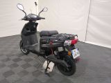 a scooter that is parked in a room