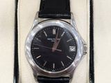 a black watch in a black box on a white surface