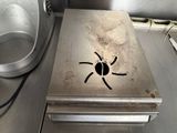an image of a metal box with a spider drawn on it
