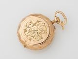 an image of a gold pocket watch on a white surface