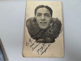 an old photo of a man with a pair of boxing gloves