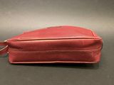 an image of a red bag sitting on top of a table