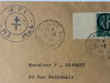 a brown envelope with stamps on it with a picture of a clock on it