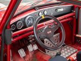 a red car with a steering wheel and dash board