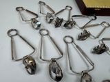 a lot of silver spoons that are on a table