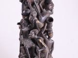 an image of a statue of a group of people on a pedestal
