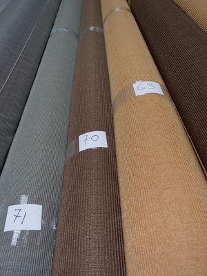 a lot of different colors of fabric on the floor