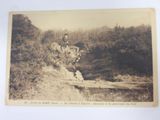 an old photo of a man riding a horse on a hill